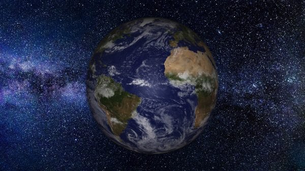 earth viewed from space with many stars visible to illustrate astronomy